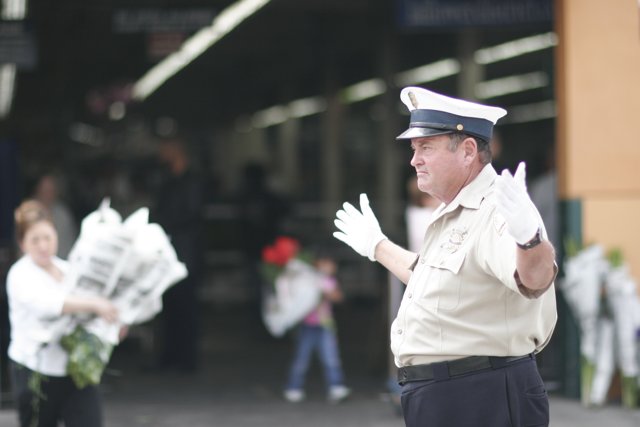 Police Officer with Flower Bouquet
