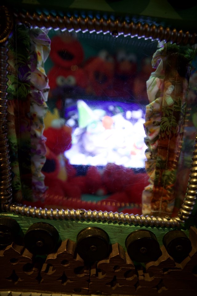 Illuminated Folk Art Display with Decorative Frame