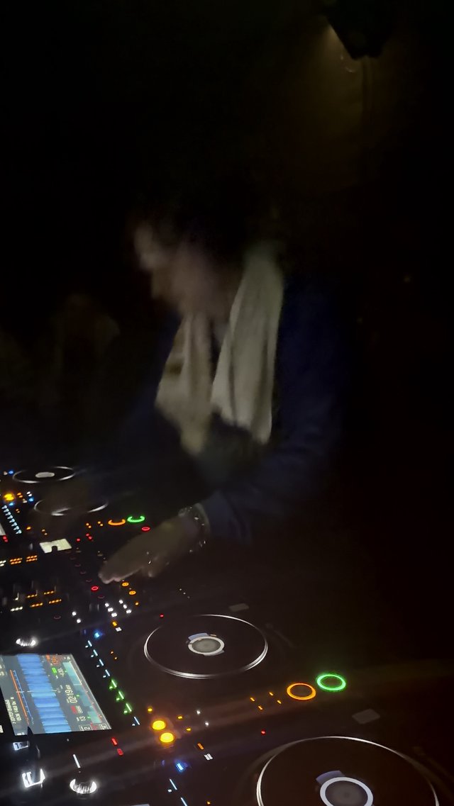 DJ Performance in Dimly Lit London Nightclub
