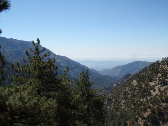 A scenic view of the mountain range from the peak