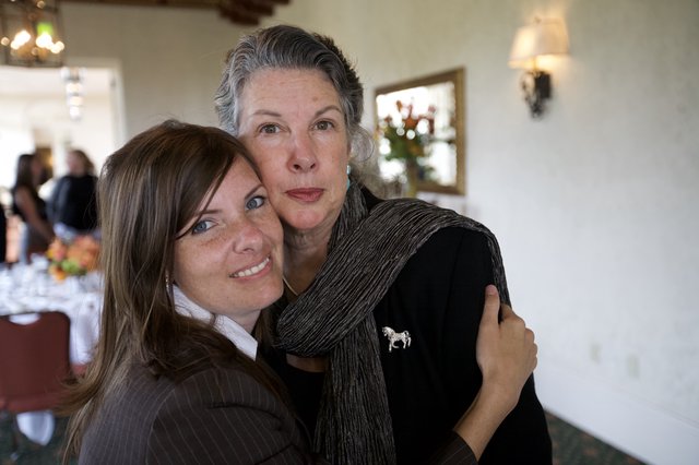 Two Women Share a Tender Moment at Gathering