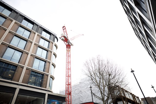 Red Construction Crane Between Modern London Buildings