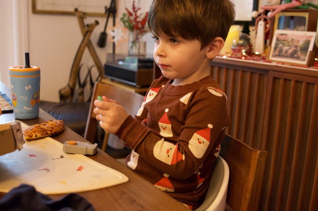 Young Boy Enjoying Christmas Evening at Home
