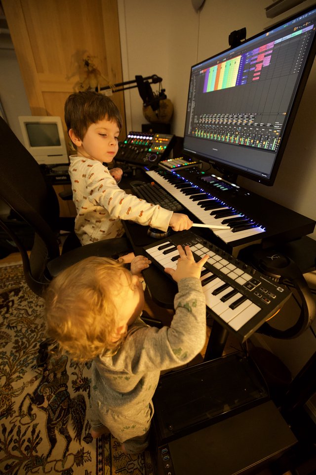 Young Brothers Creating Music in Home Recording Studio