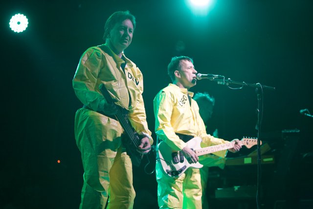 Yellow-Suited Men Rocking the Stage