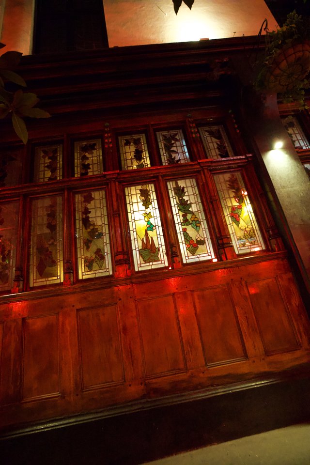 Traditional Chinese Building with Illuminated Stained Glass Windows at Night