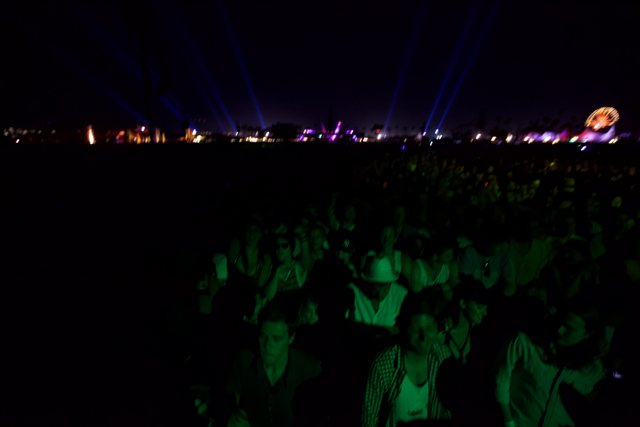 Green-Lit Crowd at Cochella Concert