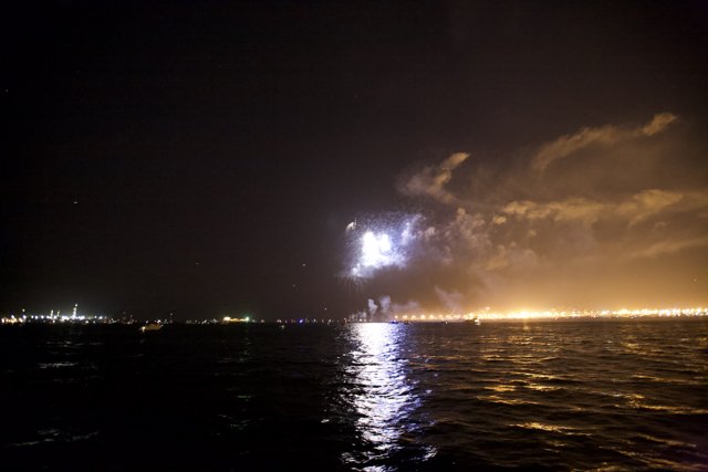 Fireworks Flare Over the Ocean