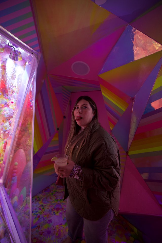 Woman Exploring Colorful Geometric Art Installation