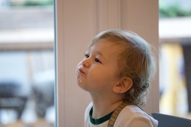 Young Child Looking Up with Wonder and Curiosity