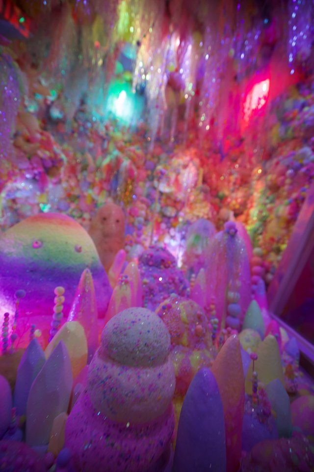 Vibrant Crystal Formations in Luminous Cave Display