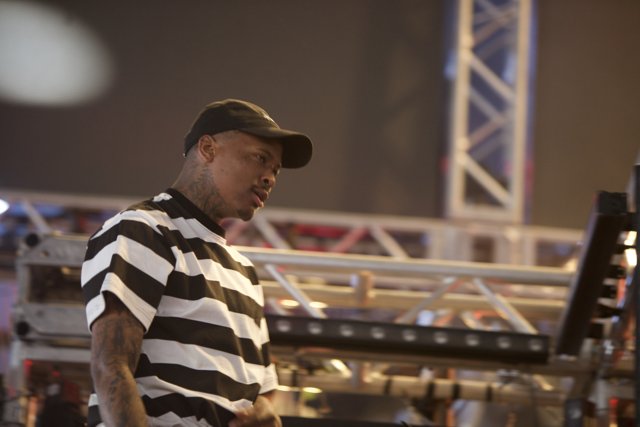 YG Takes the Stage in Stripes and Cap