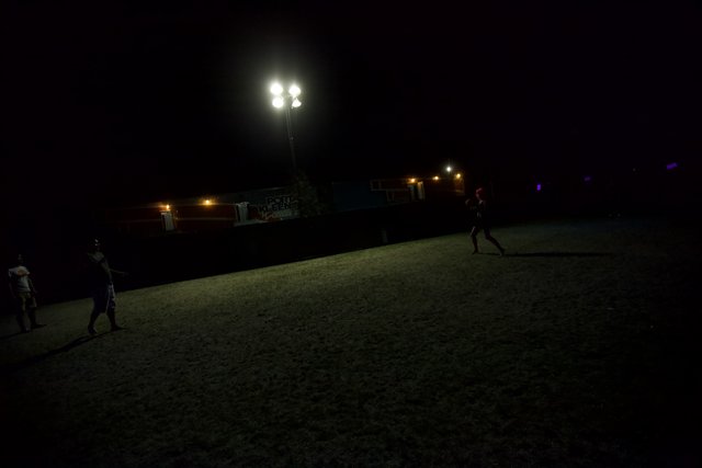 Nighttime Soccer Game Under the Moonlight