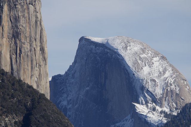 Half Dome's Iconic Silhouette Framed by El Capitan