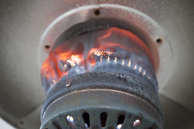 Glowing Flames Inside a Metal Burner Chamber