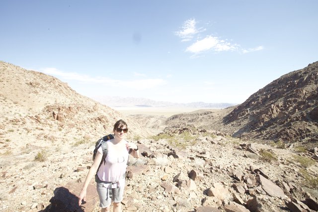 Desert Hiker Pauses at Rocky Canyon Pass