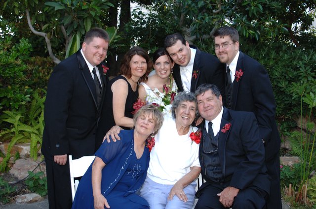 Family Wedding Portrait in Lush Garden Setting