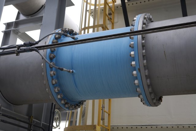 The Blue and Silver Spiral of a Factory Pipe