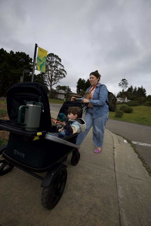 Mother and Child Strolling Through Suburban Park