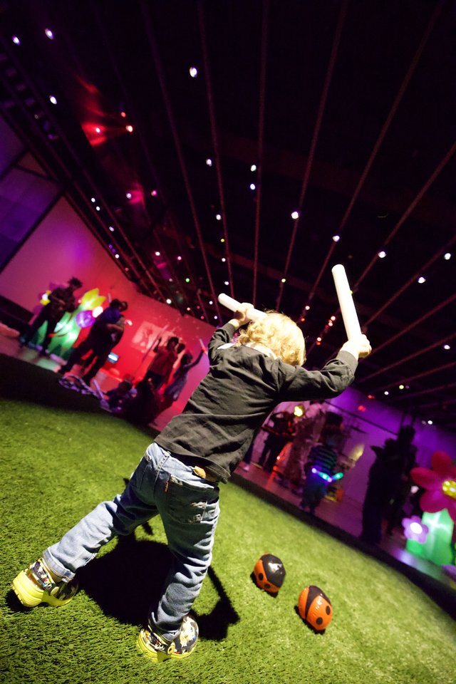 Child Playing Baseball at Baby Rave Event
