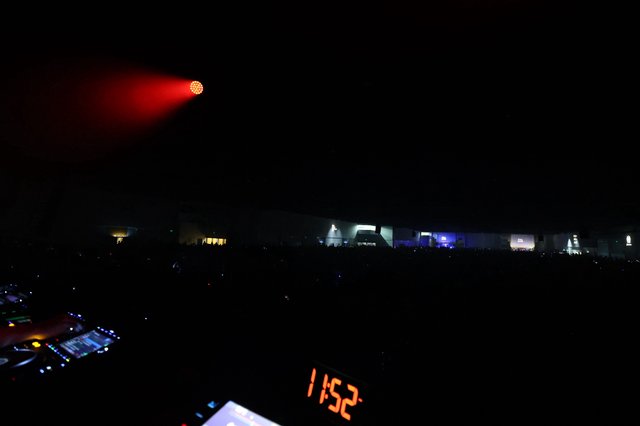 Red Light Blazing Over Midnight Festival Crowd