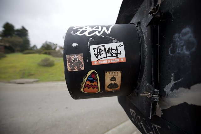 Travel Stickers on Black Cylindrical Post