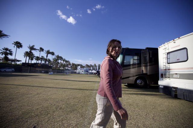 Woman Strolling Through Coachella Festival Grounds at Dusk