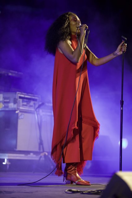 Solange Shines in Red Dress Solo Performance