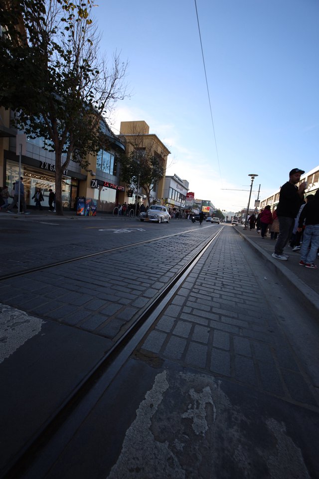 Twilight on a European Shopping Street with Tram Tracks