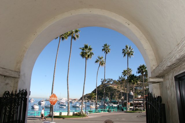 A Serene Harbor View from an Archway