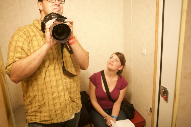 Photographer and Friend in Cramped Indoor Space