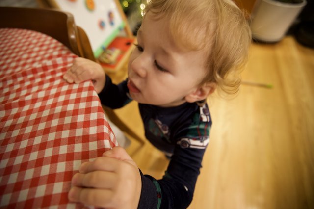 Young Child Drawing at Table on Christmas Morning