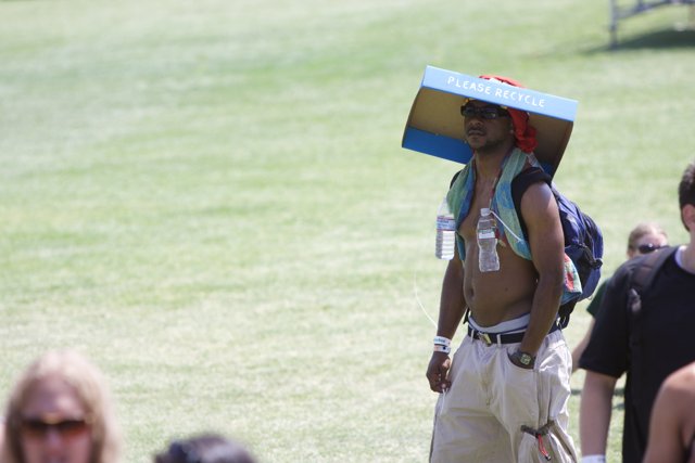 Box-Carrying Man with Sun Hat