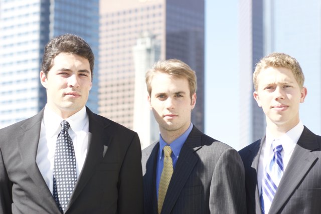 Three Men in Suits Striking a Pose