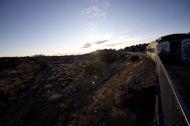 Sunset Train Journey Through Arizona Desert Landscape