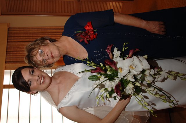 Bride and Mother Share a Joyful Wedding Day Moment