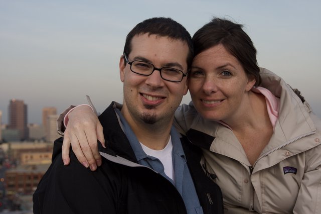 Couple Smiling Together Against City Skyline