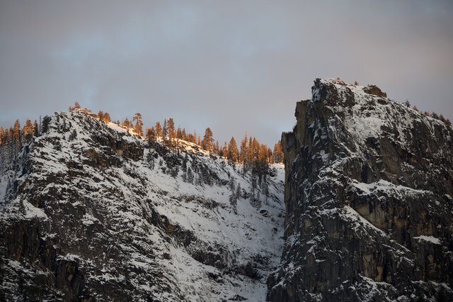 Golden Hour Light on Snow-Covered Mountain Peaks