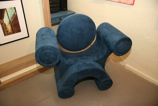 Blue Armchair in Art-Filled Room