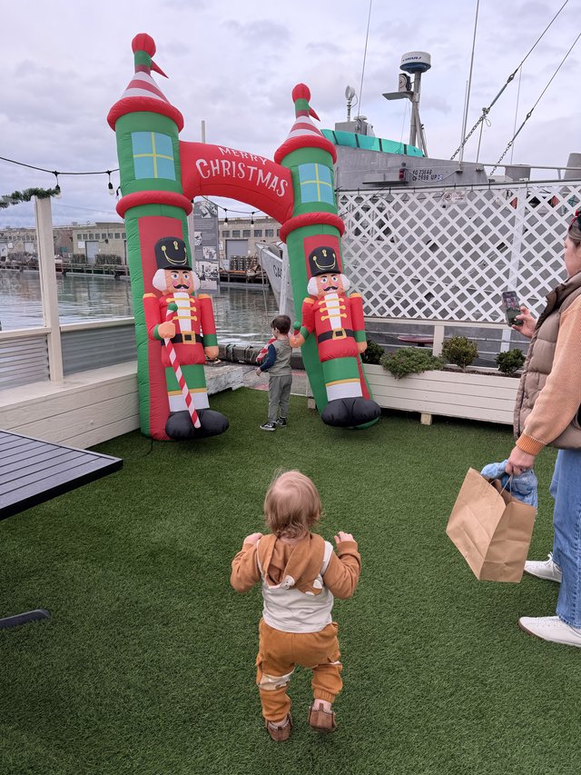 Toddler Enjoying Christmas Display at Marina