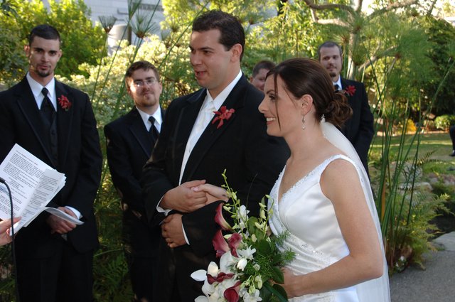 Outdoor Wedding Ceremony Ring Exchange in Garden