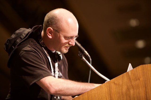 Bald Man Speaking at DefCon 17