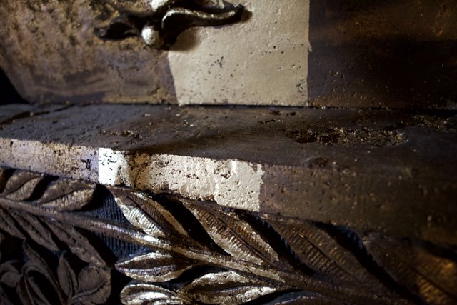 Glittering Bronze Emblem in a Crypt