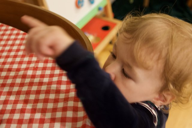 Child's Joyful Moment at Christmas Dinner Table