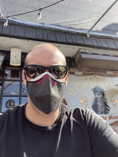 Masked Man in Front of Bar