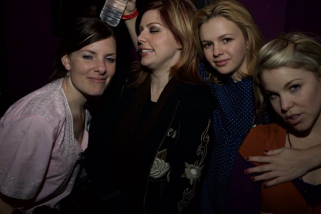 Four Friends Celebrating at a Nightclub Event