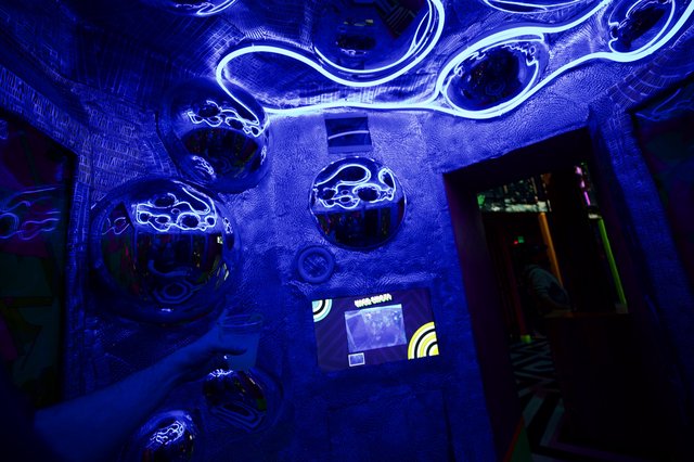 Immersive UV Light Installation with Glowing Tentacles