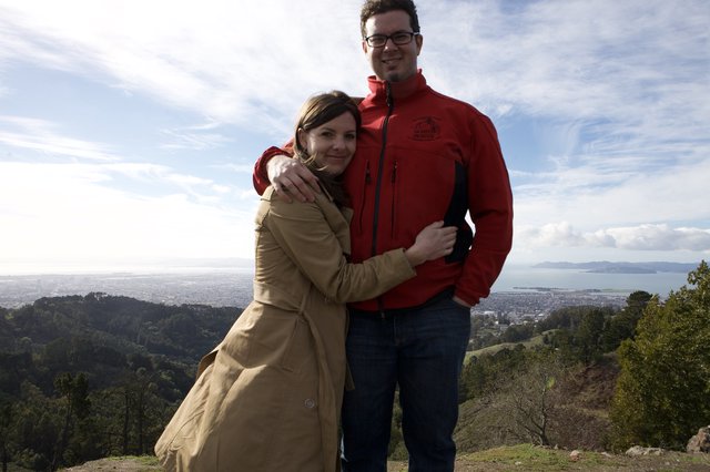 Couple Embracing Atop Berkeley Hills Overlooking San Francisco Bay