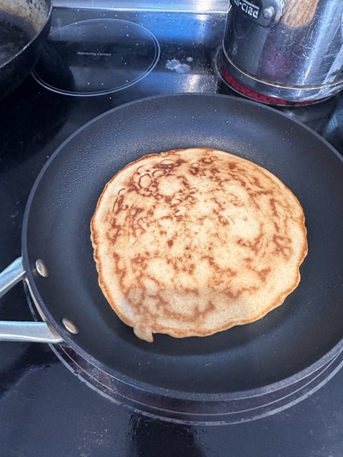Fluffy Pancake Cooking on the Stove