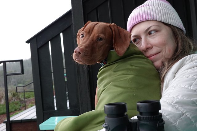 Woman and Dog Enjoying Outdoor Winter Moment